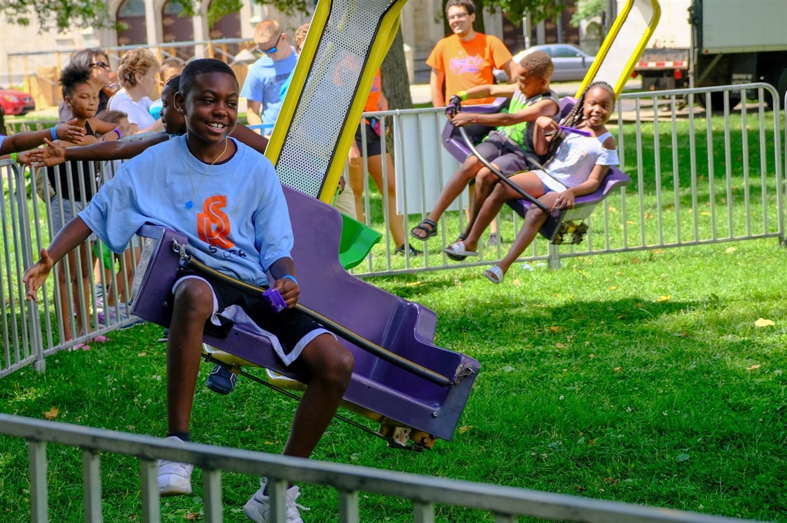 Youth on rotating carnival ride. 