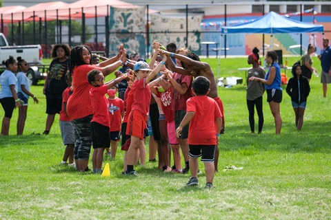 Youth celebrating at summer camp.