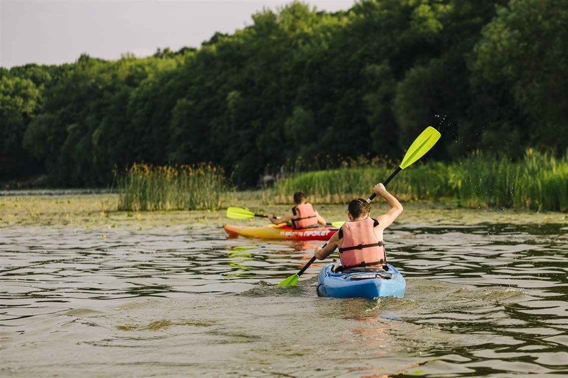 two-people-kayaking-lake.jpg