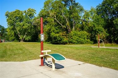 A photo of an outdoor exercise equipment station in Rockwell Park. 